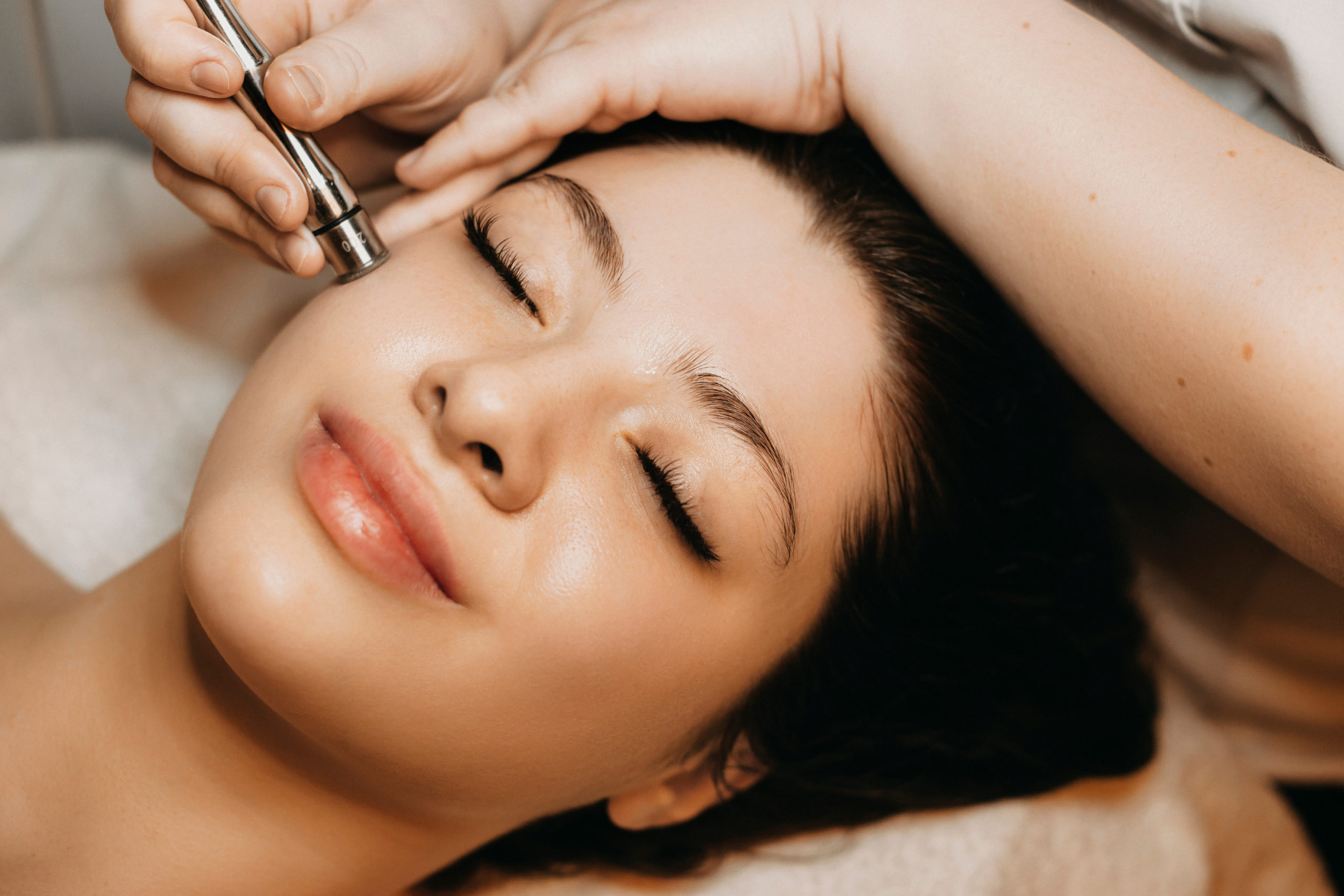 Young Beautiful Woman Having Microdermabrasion Treatment | Kendall Esthetics in Sidney, NE